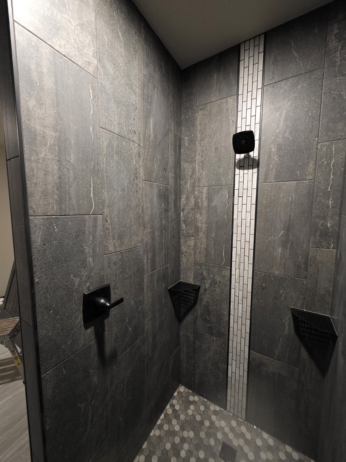 Charcoal tile with a white mosaic stripe