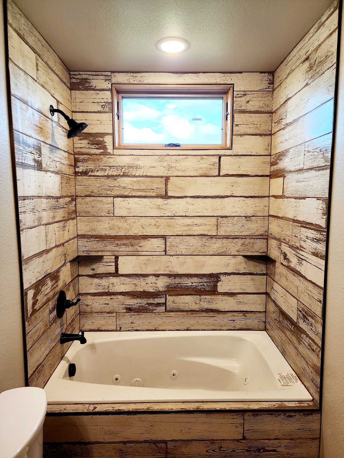 Tub surround in rustic barn-wood-look tile